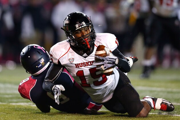 TOLEDO, OH - NOVEMBER 20:  Jimmie Ward #15 of the Northern Illinois Huskies intercepts a pass intended for Alonzo Russell #9 of the Toledo Rockets during the first quarter on November 20, 2013 at the Glass Bowl in Toledo, Ohio. (Photo by Kirk Irwin/Getty Images)