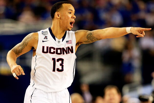 ARLINGTON, TX - APRIL 07: Shabazz Napier #13 of the Connecticut Huskies calls a play against the Kentucky Wildcats during the NCAA Men's Final Four Championship at AT&T Stadium on April 7, 2014 in Arlington, Texas.  (Photo by Jamie Squire/Getty Images)