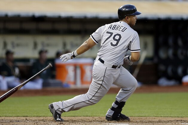 Chicago White Sox Jose Abreu throws his bat after hitting a single off Oakland Athletics' Drew Pomeranz in the fourth inning of a baseball game Tuesday, May 13, 2014, in Oakland, Calif. (AP Photo)
