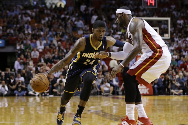 Indiana Pacers' Paul George (24) drives to the basket as Miami Heat's LeBron James defends during the first half of an NBA basketball game, Friday, April 11, 2014, in Miami. (AP Photo/Lynne Sladky)
