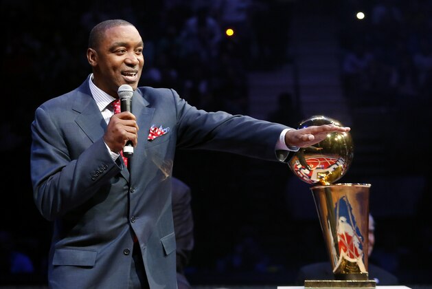 Former Detroit Pistons player Isiah Thomas addresses the audience during a half-time celebration of  the 1989 NBA championship during an NBA basketball game against the Miami Heat, Friday, March 28, 2014, in Auburn Hills, Mich. (AP Photo/Duane Burleson)