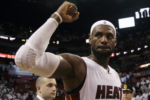 Miami Heat forward LeBron James celebrates their 96-94 win against the Brooklyn Nets  during after Game 5 of a second-round NBA playoff basketball game in Miami, Wednesday, May 14, 2014. (AP Photo)