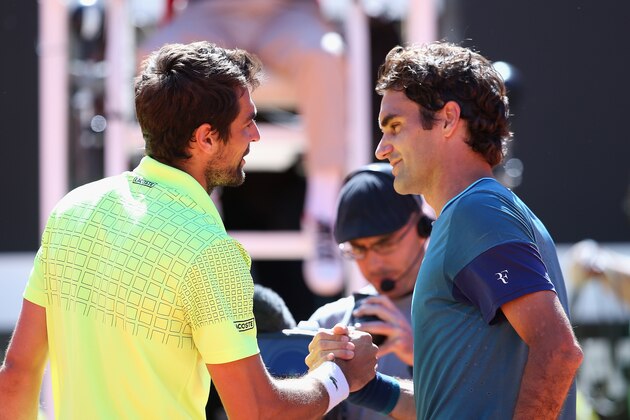ROME, ITALY - MAY 14:  Jeremy Chardy of France is congratulated by Roger Federer of Switzerland after their match during day four of the Internazionali BNL d'Italia tennis 2014 on May 14, 2014 in Rome, Italy.  (Photo by Julian Finney/Getty Images)