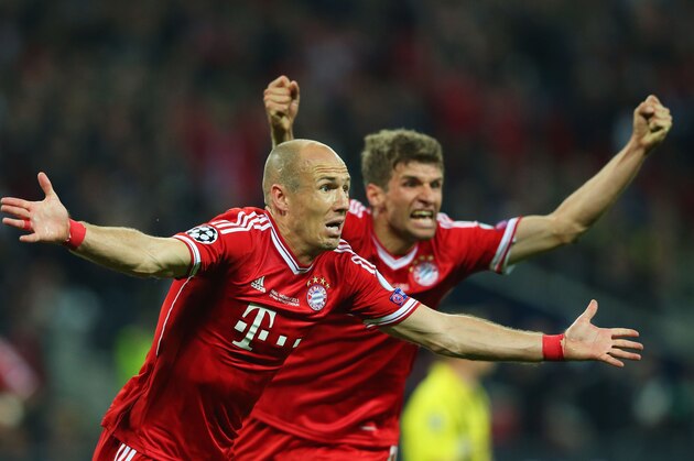 LONDON, ENGLAND - MAY 25:  Arjen Robben of Bayern Muenchen celebrates with team-mate Thomas Mueller after scoring a goal during the UEFA Champions League final match between Borussia Dortmund and FC Bayern Muenchen at Wembley Stadium on May 25, 2013 in London, United Kingdom.  (Photo by Alex Livesey/Getty Images)