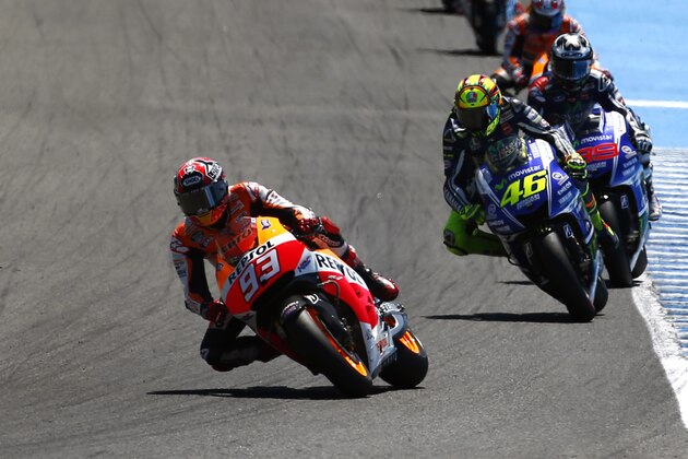MotoGP raider Marc Marquez of Spain leads the race followed by Valentino Rossi of Italy and Jorge Lorenzo of Spain during the Spain's Motorcycle Grand Prix at the Jerez race track on Sunday, May 4, 2014 in Jerez de la Frontera, southern Spain. (AP Photo/Miguel Angel Morenatti)