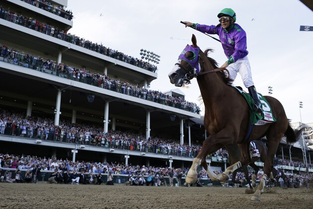 Victor Espinoza rides California Chrome to victory during the 140th running of the Kentucky Derby horse race at Churchill Downs Saturday, May 3, 2014, in Louisville, Ky.  (AP Photo/David J. Phillip)