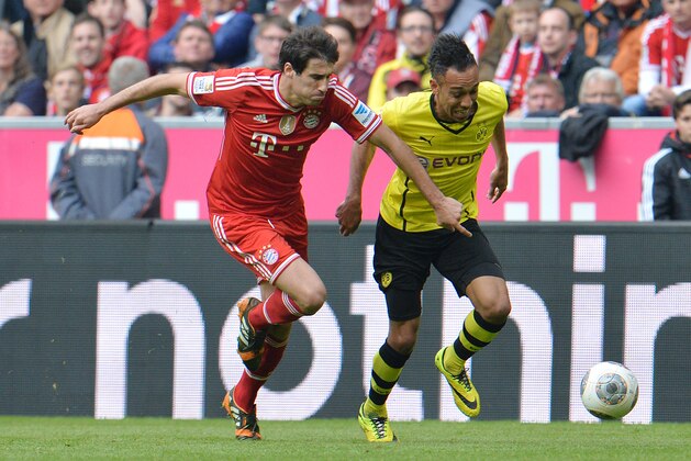 Bayern's Javier Martinez of Spain, left, and Dortmund's Pierre-Emerick Aubameyang of Gabon challenge for the ball during the Bundesliga soccer match between FC Bayern Munich and Borussia Dortmund in Munich, Germany, on Saturday, April 12, 2014. (AP Photo/Kerstin Joensson) Bayern's Javier Martinez of Spain, left, and Dortmund's Pierre-Emerick Aubameyang of Gabon challenge for the ball during the Bundesliga soccer match between FC Bayern Munich and Borussia Dortmund in Munich, Germany, on Saturday, April 12, 2014. (AP Photo/Kerstin Joensson)