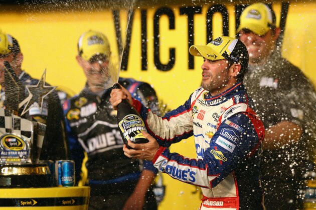 CONCORD, NC - MAY 18:  Jimmie Johnson, driver of the #48 Lowe's Patriotic Chevrolet, celebrates in Victory Lane after winning the NASCAR Sprint Cup Series All-Star race at Charlotte Motor Speedway on May 18, 2013 in Concord, North Carolina.  (Photo by Streeter Lecka/Getty Images)