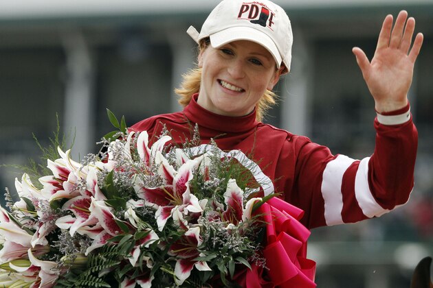 Rosie Napravnik celebrates after riding Untapable to victory during the 140th running of the Kentucky Oaks horse race at Churchill Downs Friday, May 2, 2014, in Louisville, Ky. (AP Photo/Garry Jones)
