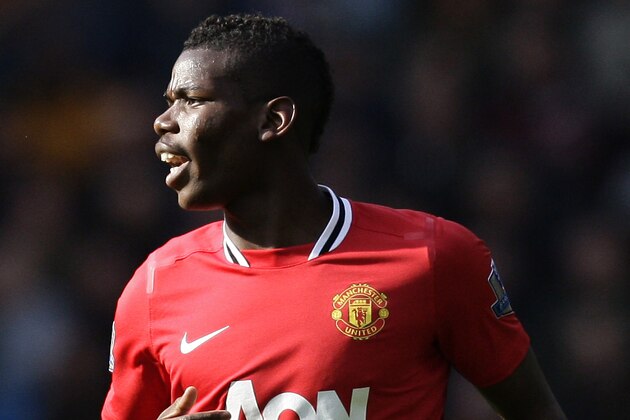 Manchester United's Manchester United's Paul Pogba during his team's English Premier League soccer match against Wolverhampton Wanderers at Molineux Stadium, Wolverhampton, England, Sunday, March 18, 2012. (AP Photo/Jon Super)