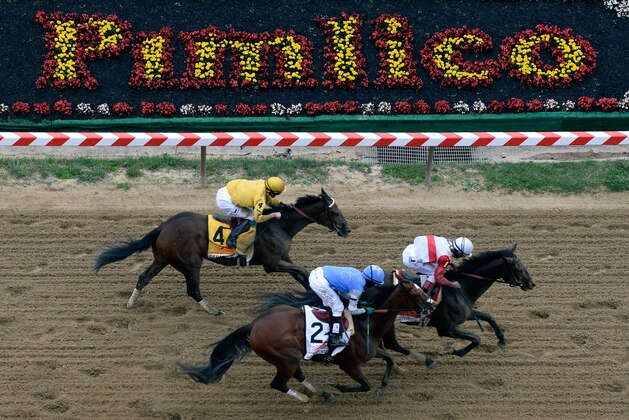 BALTIMORE, MD - MAY 18:  Orb #1, ridden by Joel Rosario, leads Glodencents #2, ridden by Kevin Krigger, and Departing #4, ridden by Brain Hernandez Jr., down the frontstretch at the start of the 138th running of the Preakness Stakes at Pimlico Race Course on May 18, 2013 in Baltimore, Maryland.  (Photo by Patrick Smith/Getty Images)