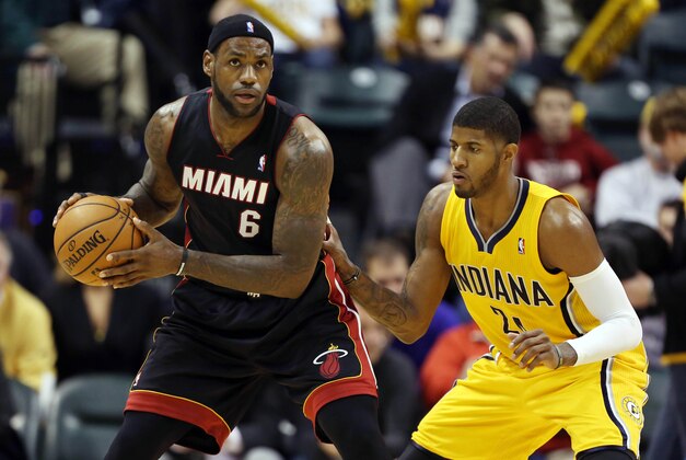 Dec 10, 2013; Indianapolis, IN, USA; Miami Heat  guard LeBron James (6) is guarded by Indiana Pacers forward Paul George (24) at Bankers Life Fieldhouse. Indiana defeats Miami 90-84. Mandatory Credit: Brian Spurlock-USA TODAY Sports
