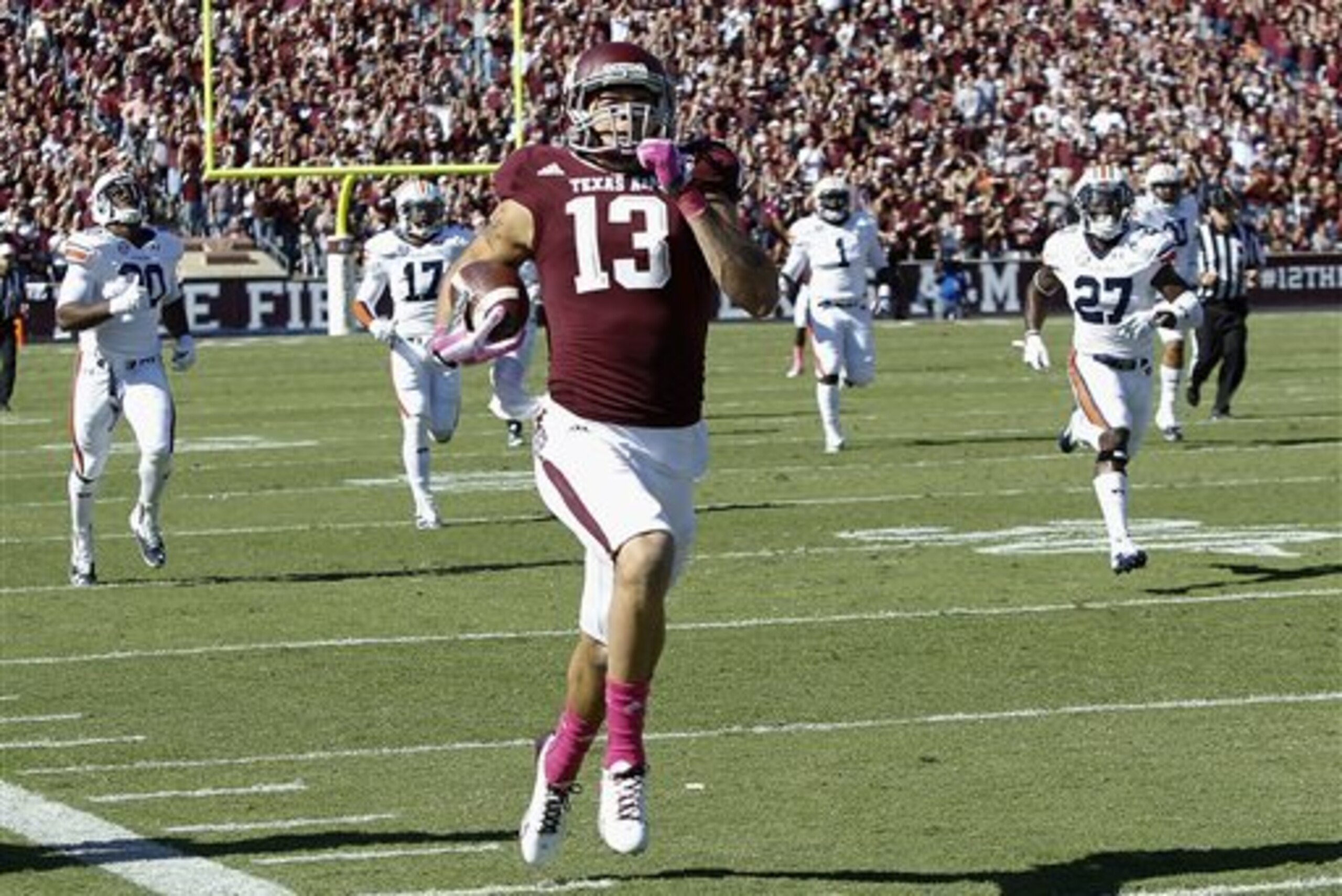 Texas A&M wide receiver Mike Evans (13) runs a 64-yard touchdown against Auburn in the first half during an NCAA college football game Saturday, Oct. 19, 2013, in College Station, Texas. (AP Photo/Bob Levey)