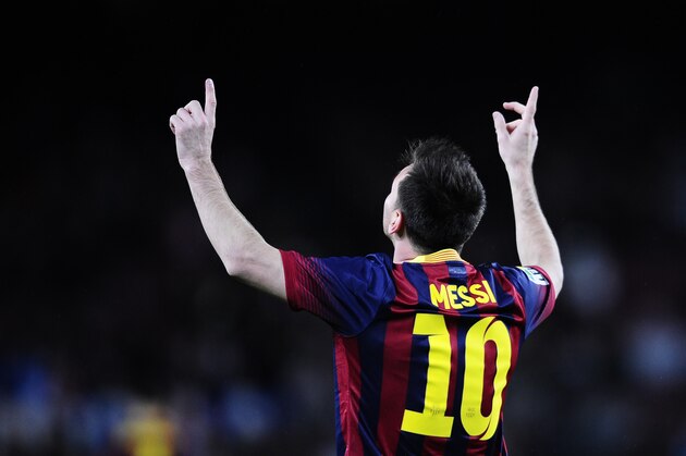 FC Barcelona's Lionel Messi, from Argentina, reacts after scoring during a Spanish La Liga soccer match against Celta Vigo at the Camp Nou stadium in Barcelona, Spain, Wednesday, March 26, 2014. (AP Photo/Manu Fernandez)