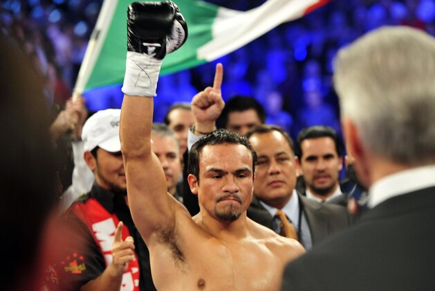 Dec 8, 2012; Las Vegas, NV, USA; Juan Manuel Marquez enters the ring before boxing Manny Pacquiao (not pictured) in their welterweight bout at MGM Grand Garden Arena. Juan Manuel Marquez won the bout by sixth round knockout. Mandatory Credit: Joe Camporeale-USA TODAY Sports
