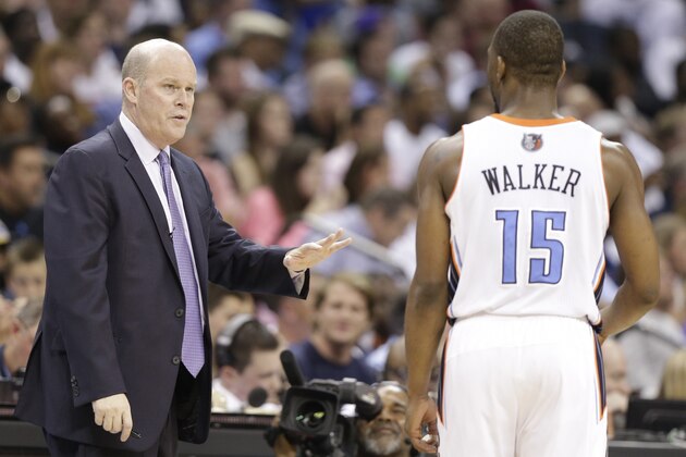 Charlotte Bobcats head coach Steve Clifford, left, talks with Kemba Walker, right, during the second half in Game 4 of an opening-round NBA basketball playoff series against the Miami Heat in Charlotte, N.C., Monday, April 28, 2014. The Heat won 109-98. (AP Photo/Chuck Burton)