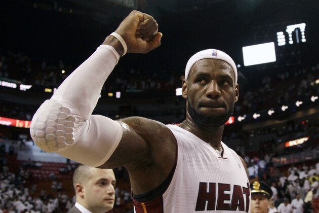 Miami Heat forward LeBron James celebrates their 96-94 win against the Brooklyn Nets  during after Game 5 of a second-round NBA playoff basketball game in Miami, Wednesday, May 14, 2014. (AP Photo)