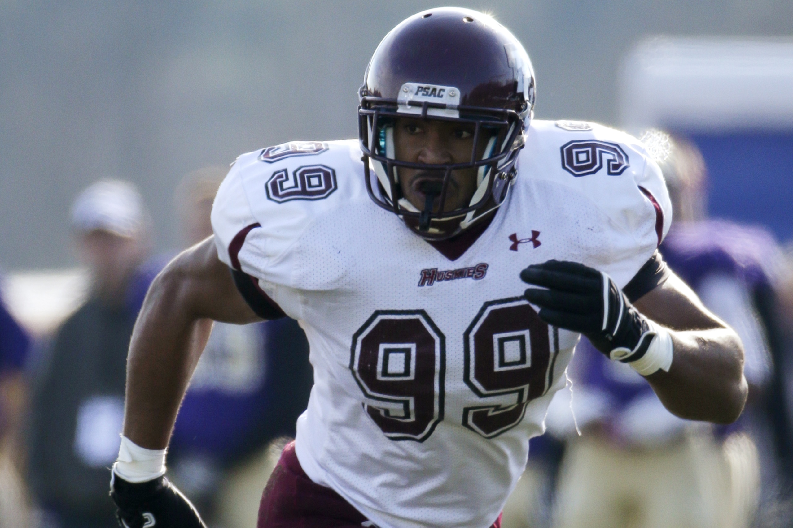 FILE - In this Nov. 9, 2013, file photo, Bloomsburg defensive end Larry Webster chases the action during an NCAA Division II college football game against West Chester in West Chester, Pa.  Webster, whose father played in the NFL, started his college career as a basketball player before emerging as a pass-rushing force at Bloomsburg. Webster never got the chance to become a household name in college. NFL scouts found him anyway, playing Division II football.  (AP Photo/Matt Slocum, File)