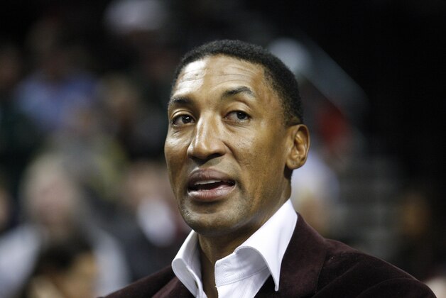 Former NBA player Scottie Pippen looks on during an NBA basketball game with the Miami Heat and the Portland Trail Blazers Thursday, March 1, 2012, in Portland, Ore. (AP Photo/Rick Bowmer)