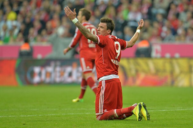 Bayern's Mario Mandzukic of Croatia gestures on the pitch during the Bundesliga soccer match between FC Bayern Munich and Borussia Dortmund in Munich, Germany, on Saturday, April 12, 2014. (AP Photo/Kerstin Joensson)