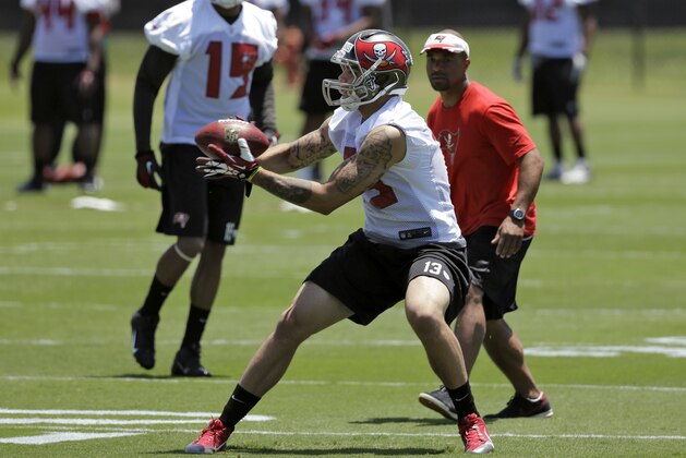 Tampa Bay Buccaneers first-round draft pick Mike Evans (13) catches a pass during NFL football rookie camp Friday, May 16, 2014, in Tampa, Fla. Evans, the seventh pick overall, played at Texas A&M. (AP Photo/Chris O'Meara)