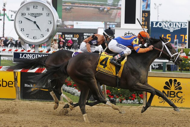Stopchargingmaria, with jockey Javier Castellano, wins the Black-Eyed Susan Stakes horse race, as Vero Amore, with Frank Pennington riding, finishes second at Pimlico Race Course, Friday, May 16, 2014, in Baltimore. (AP Photo/Mike Stewart)