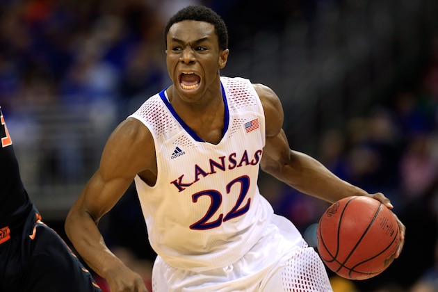 KANSAS CITY, MO - MARCH 13:  Andrew Wiggins #22 of the Kansas Jayhawks drives upcourt as Marcus Smart #33 of the Oklahoma State Cowboys defends during the Big 12 Basketball Tournament quarterfinal game at Sprint Center on March 13, 2014 in Kansas City, Missouri.  (Photo by Jamie Squire/Getty Images)