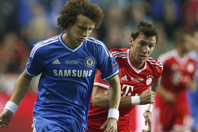 Chelsea's David Luiz, left shields the ball from Bayern's Mario Mandzukic during the soccer Super Cup final between Champions League winner Bayern Munich and Europa League winner Chelsea FC  at the Eden Stadium in Prague Friday, Aug. 30, 2013. (AP Photo/Michael Sohn)