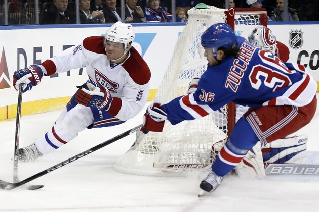 New York Rangers right wing Mats Zuccarello (36) of Norway tries to steal the puck from Montreal Canadiens defenseman Douglas Murray (6) in the second period of their NHL hockey game at Madison Square Garden in New York, Monday, Oct. 28, 2013.  (AP Photo/Kathy Willens)