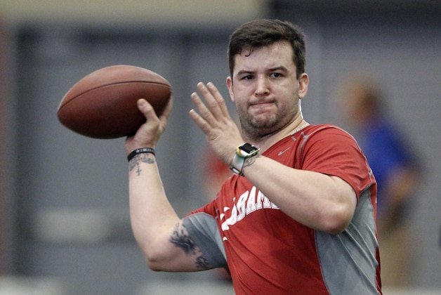 AJ McCarron throws a pass in front of NFL scouts during Pro Day at the University of Alabama on Wednesday, Mar. 12, 2014, in Tuscaloosa, Ala. (AP Photo/Butch Dill)