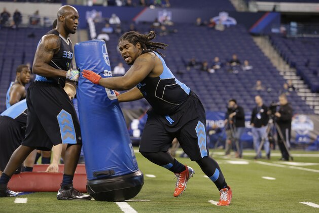 Arizona State defensive lineman Will Sutton runs a drill at the NFL football scouting combine in Indianapolis, Monday, Feb. 24, 2014. (AP Photo/Michael Conroy)