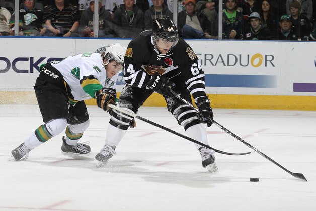 LONDON, ON - MAY 16:  Guillaume Gelinas #5 of the Val'Dor Foreurs defends against Ryan Rupert #64 of the London Knights in Game One of the 2014 Mastercard Memorial Cup Championship at the Budweiser Gardens on May 16, 2014 in London, Ontario, Canada. (Photo by Claus Andersen/Getty Images)
