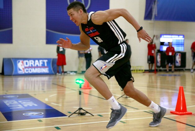 Aaron Gordon, from Arizona, participates in the lane agility course at the 2014 NBA basketball draft combine Friday, May 16, 2014, in Chicago. (AP Photo/Charles Rex Arbogast)