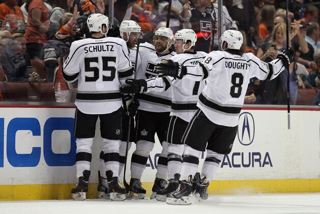 ANAHEIM, CA - MAY 16:  (L-R) Jeff Schultz #55, Jeff Carter #77, Marian Gaborik #12, Tyler Toffoli #73 and Drew Doughty #8 of the Los Angeles Kings celebrate Carter's first period goal against the Anaheim Ducks in Game Seven of the Second Round of the 2014 NHL Stanley Cup Playoffs at Honda Center on May 16, 2014 in Anaheim, California.  (Photo by Jeff Gross/Getty Images)