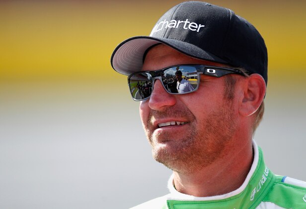 CHARLOTTE, NC - MAY 16:  Clint Bowyer, driver of the #15 Charter Toyota, talks to Michael Waltrip, of Michael Waltrip Racing, during qualifying for the NASCAR Sprint Cup Series Sprint Showdown at Charlotte Motor Speedway on May 16, 2014 in Charlotte, North Carolina.  (Photo by Sarah Glenn/Getty Images)