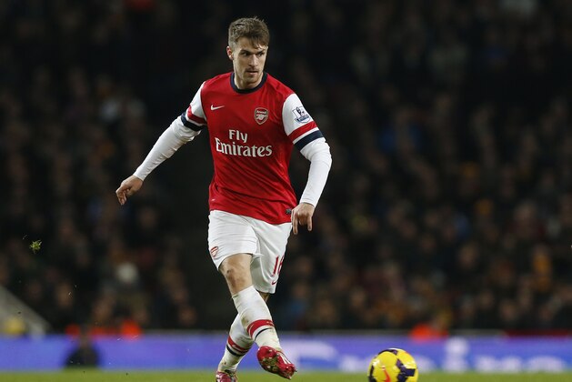 Arsenal's Aaron Ramsey plays against Hull City during their English Premier League soccer match at Emirates Stadium in London, Wednesday, Dec. 4, 2013. (AP Photo/Sang Tan)