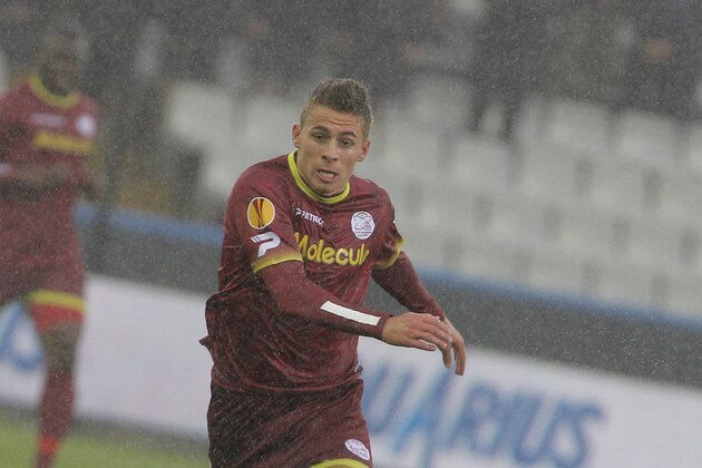 Zulte-Waregem Thorgan Hazard, left, challenges Wigan Athletic Jordi Gomez, during the Europa League group stages in group D, at the Jan Breydel stadium in Bruges, Belgium, Thursday, Sept. 19, 2013. (AP Photo/Yves Logghe)