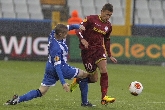 Wigan Athletic James McClean, left, tackles Zulte-Waregem's Thorgan Hazard, during the Europa League group stages in group D, at the Jan Breydel stadium in Bruges, Belgium, Thursday, Sept. 19, 2013. (AP Photo/Yves Logghe)