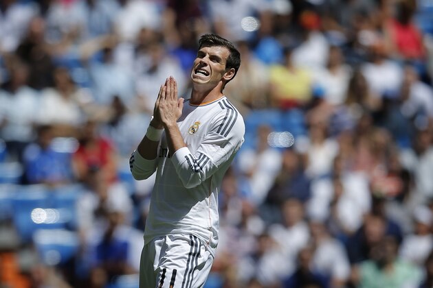 Real Madrid's Gareth Bale from Wales gestures during a Spanish La Liga soccer match between Real Madrid and Espanyol at the Santiago Bernabeu stadium  in Madrid, Spain, Saturday, May 17, 2014. (AP Photo/Daniel Ochoa de Olza)