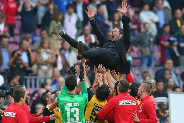 BARCELONA, SPAIN - MAY 17:  Diego Simeone the coach of Club Atletico de Madrid is thrown in the air by his players after winning the La Liga after the match between FC Barcelona and Club Atletico de Madrid at Camp Nou on May 17, 2014 in Barcelona, Spain.  (Photo by Alex Livesey/Getty Images)
