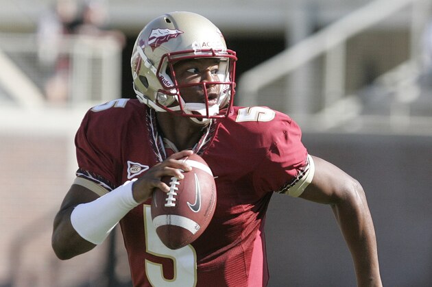 Florida State garnet quarterback Jameis Winston looks for a receiver as he scrambles in the second half of an NCAA college spring football game on Saturday, April 12, 2014, in Tallahassee, Fla. (AP Photo/Steve Cannon)