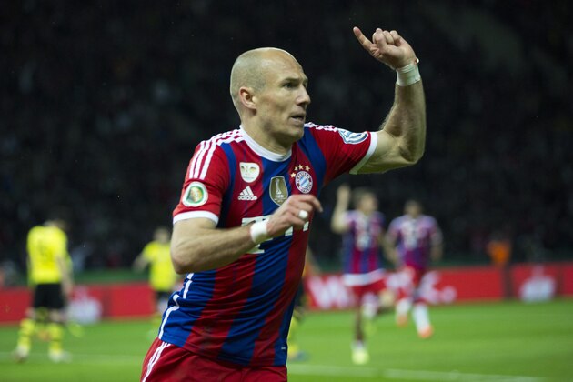 Bayern's Arjen Robben of the Netherlands celebrates scoring his side's first goal during the German Soccer Cup Final between FC Bayern Munich and Borussia Dortmund at the Olympic Stadium in Berlin, Germany, Saturday, May 17, 2014. (AP Photo/Gero Breloer)