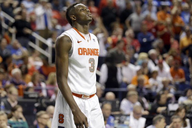Syracuse's Jerami Grant (3) walks off the court after their loss to North Carolina State in a quarterfinal NCAA college basketball game at the Atlantic Coast Conference tournament in Greensboro, N.C., Friday, March 14, 2014. North Carolina State won 66-63. (AP Photo/Gerry Broome)