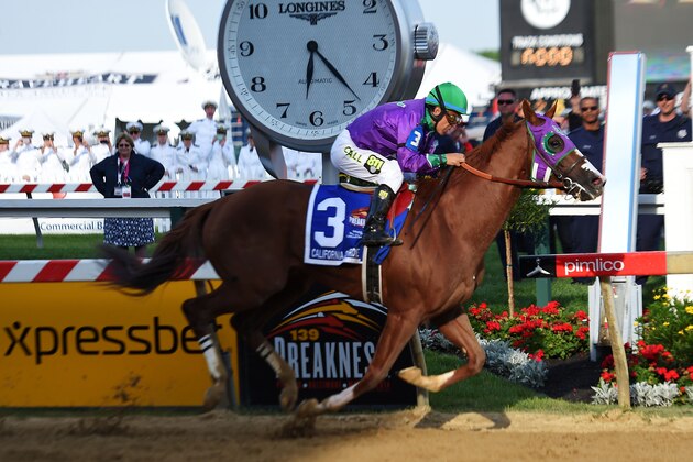 BALTIMORE, MD - MAY 17:  California Chrome #3, ridden by Victor Espinoza, crosses the finishline to win the 139th running of the Preakness Stakes at Pimlico Race Course on May 17, 2014 in Baltimore, Maryland.  (Photo by Jim Dietz/Getty Images)