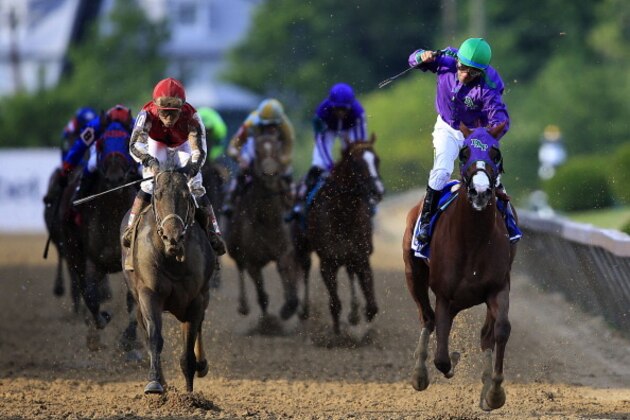 BALTIMORE, MD - MAY 17:  California Chrome #3, ridden by Victor Espinoza, crosses the finishline to win the 139th running of the Preakness Stakes at Pimlico Race Course on May 17, 2014 in Baltimore, Maryland.  (Photo by Rob Carr/Getty Images)
