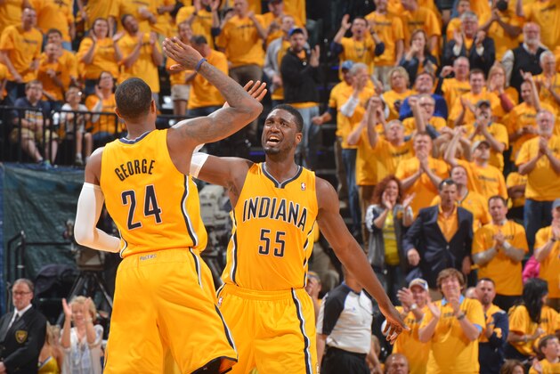 INDIANAPOLIS, IN - MAY 03: Roy Hibbert #55 and Paul George #24 of the Indiana Pacers celebrate during game Seven of the Eastern Conference Playoffs against the Atlanta Hawks at the Bankers Life Fieldhouse on May 3, 2014 in Indianapolis, Indiana. NOTE TO USER: User expressly acknowledges and agrees that, by downloading and or using this photograph, User is consenting to the terms and conditions of the Getty Images License Agreement. Mandatory Copyright Notice: Copyright 2014 NBAE  (Photo by Jesse Garrabrant/NBAE via Getty Images)