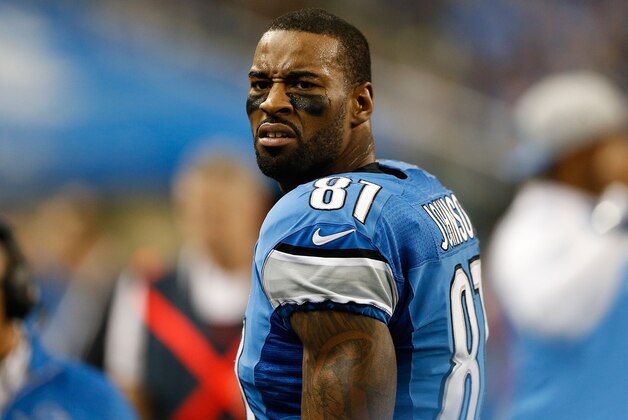 DETROIT, MI - DECEMBER 22: Calvin Johnson #81 of the Detroit Lions watches the action from the sidelines during the second quarter of thre game against the New York Giants at Ford Field on December 22, 2013 in Detroit, Michigan.  (Photo by Leon Halip/Getty Images)
