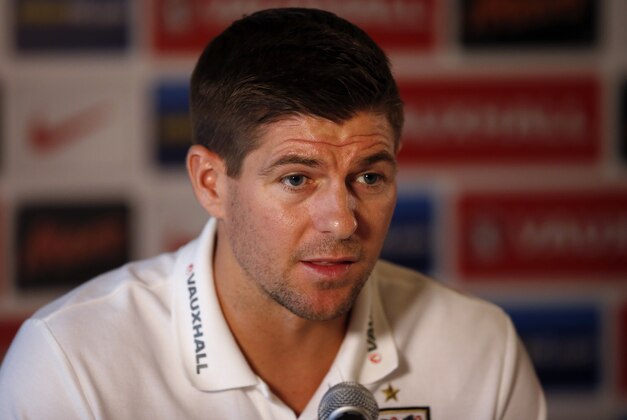 England national soccer team captain Steven Gerrard speaks during a press conference at the Grove Hotel in Chandler's Cross, England, Monday, Oct. 14, 2013.  England will play Poland in a World Cup Group H qualification soccer match at Wembley stadium in London on Tuesday.  (AP Photo/Matt Dunham)