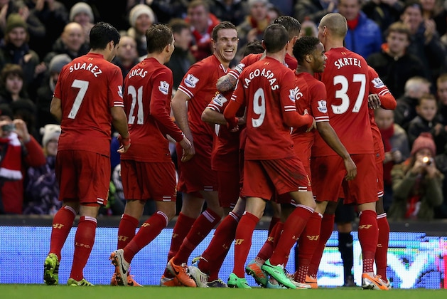 LIVERPOOL, ENGLAND - JANUARY 01:   Liverpool's Jordan Henderson and team mates celebrate after Daniel Agger has scored the first goal during the Barclays Premier League match between Liverpool and Hull City at Anfield on January 1, 2014 in Liverpool, England.  (Photo by Clive Brunskill/Getty Images)