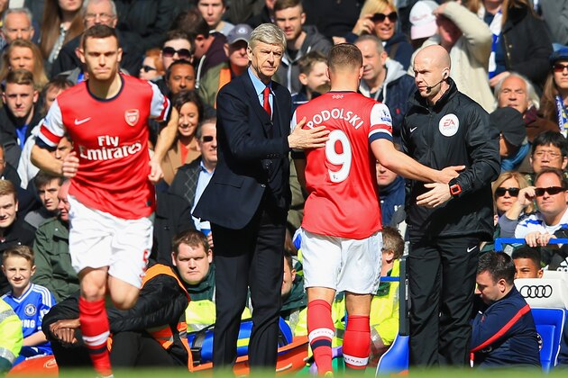 LONDON, ENGLAND - MARCH 22:  Thomas Vermaelen of Arsenal replaces Lukas Podolski of Arsenal during the Barclays Premier League match between Chelsea and Arsenal at Stamford Bridge on March 22, 2014 in London, England.  (Photo by Richard Heathcote/Getty Images)
